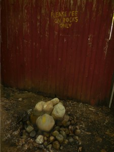 The hostel's answer to long toilet lines. You do it in the woods, why not in the backyard? 